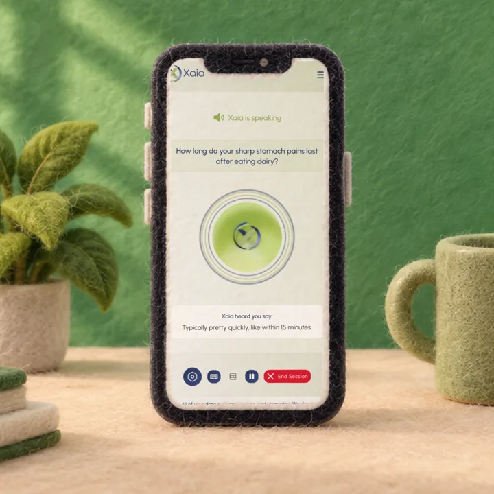 A phone showing Xaia asking a patient an intake question by voice before the visit